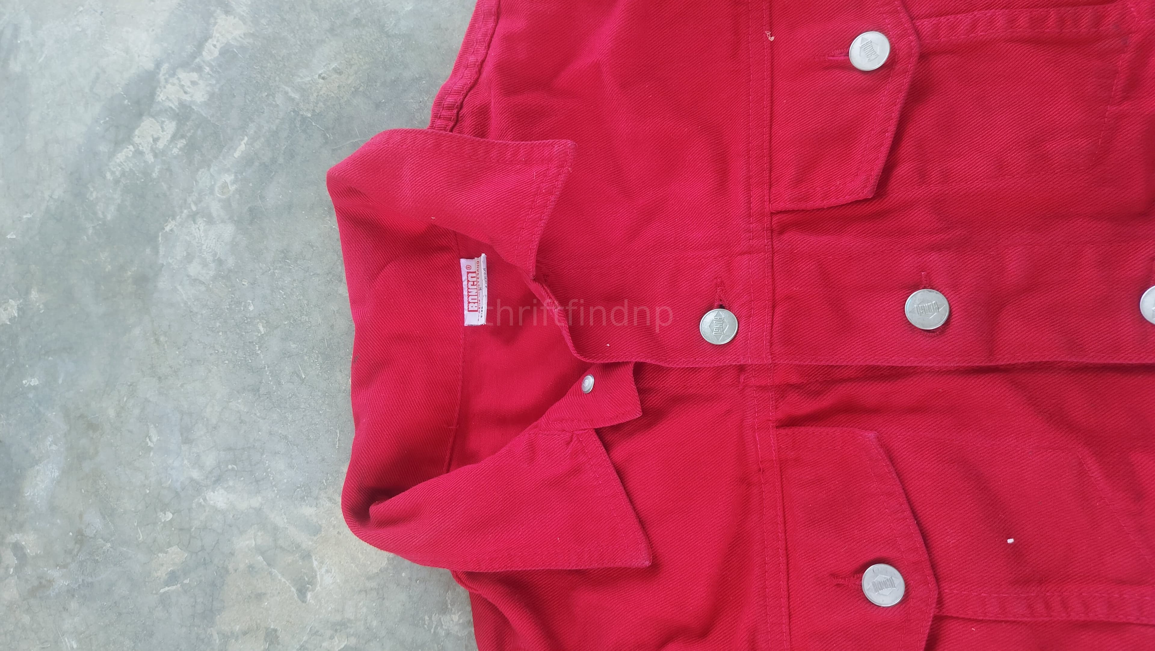 red trucker-style denim jacket